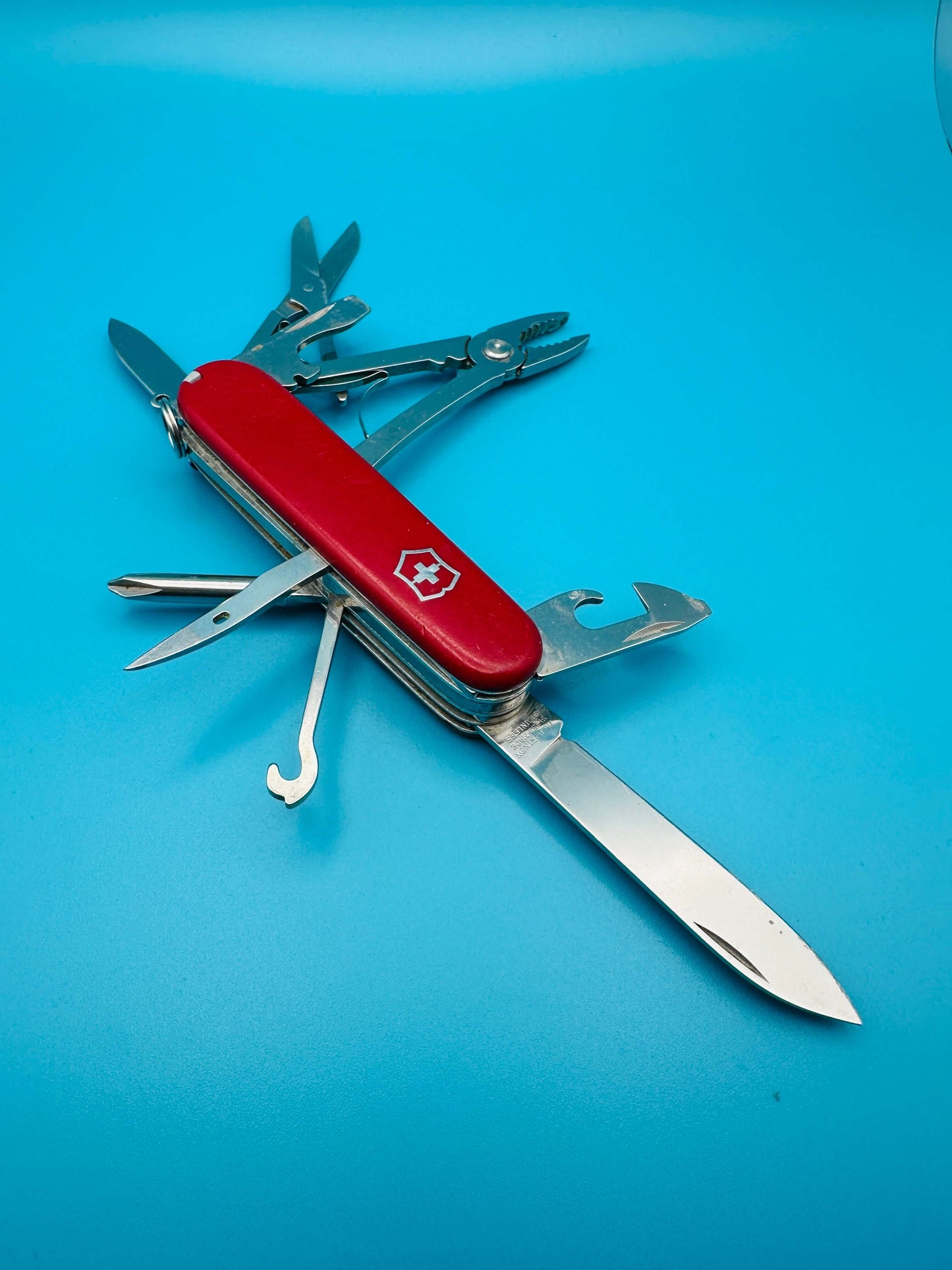 Victorinox Deluxe Tinker used Swiss Army Knife fully open with pliers and hook