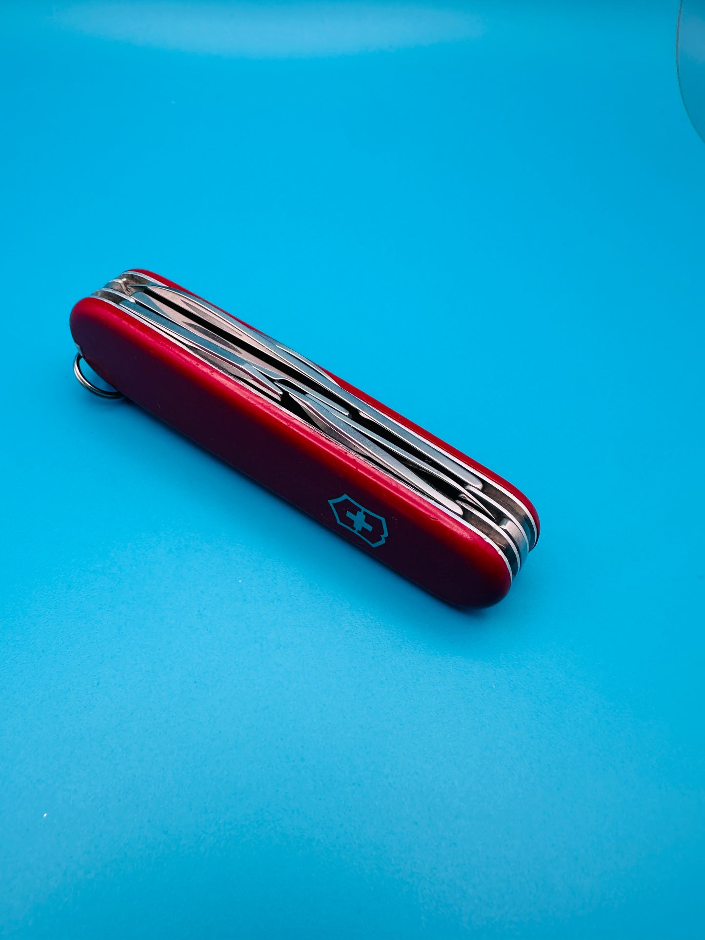 Folded Victorinox Super Tinker with visible red handle and logo