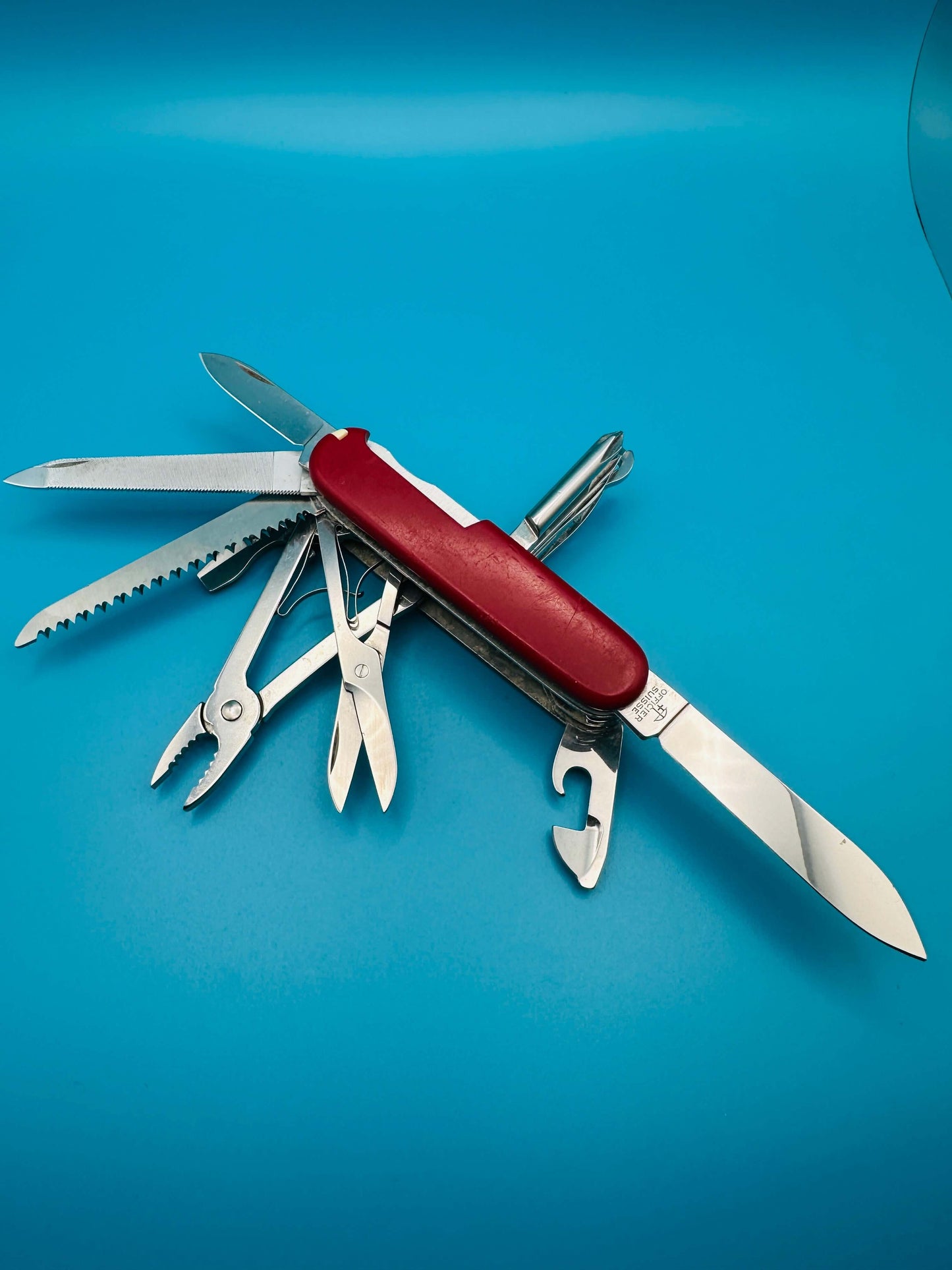 Red Victorinox Craftsman knife – used condition with minor wear on tools