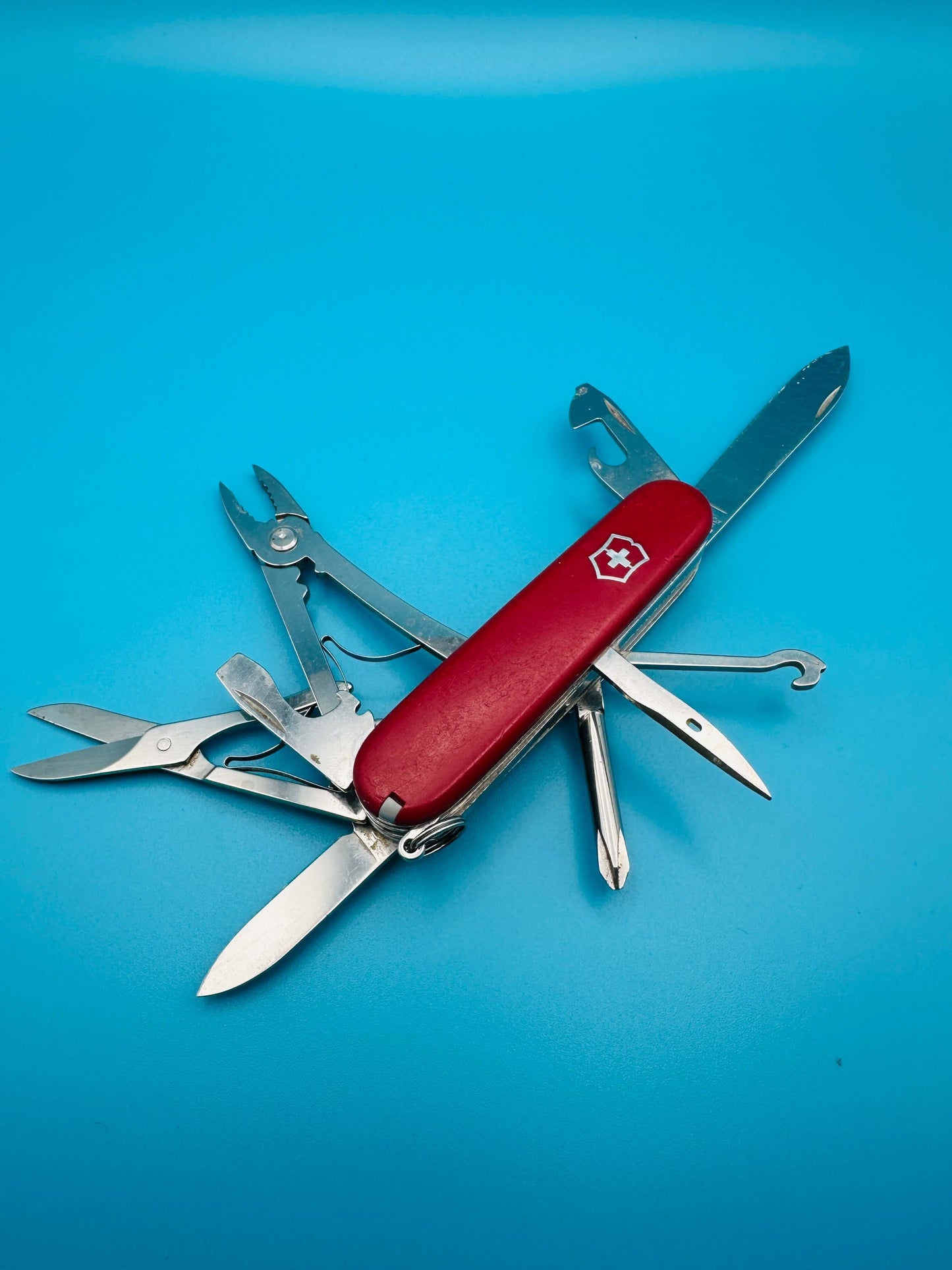 Victorinox Deluxe Tinker Swiss Army Knife showing scissors, screwdrivers, and pliers
