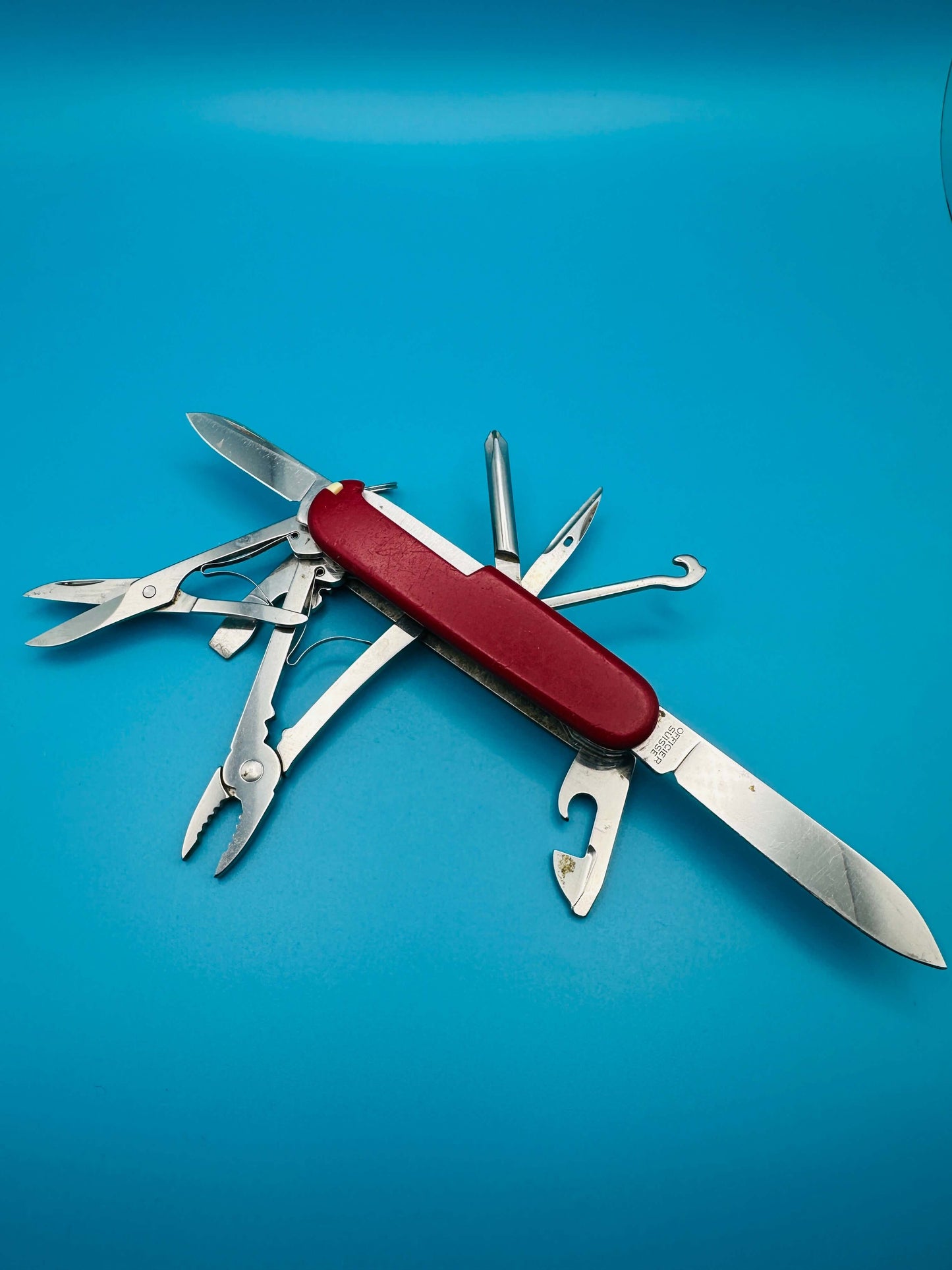 Used Victorinox Deluxe Tinker 91mm multitool with partially opened tools