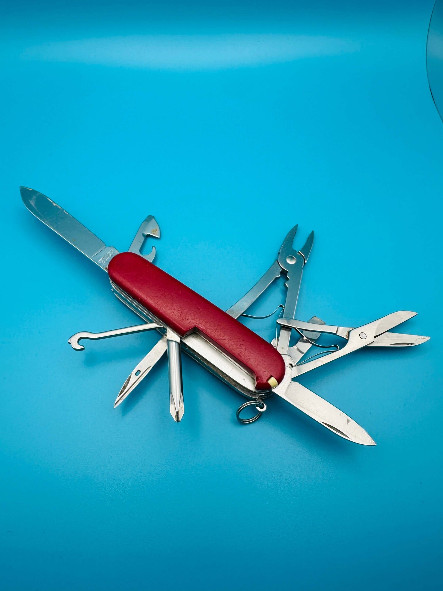 Used Victorinox Deluxe Tinker fully extended with pliers, scissors, and large blade
