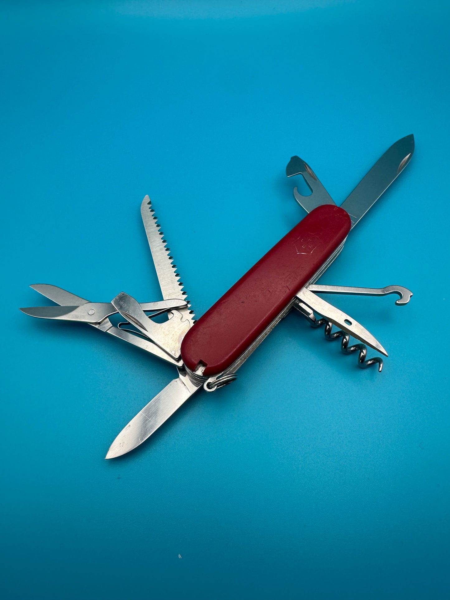 Victorinox Huntsman showing open saw, screwdriver, and other tools