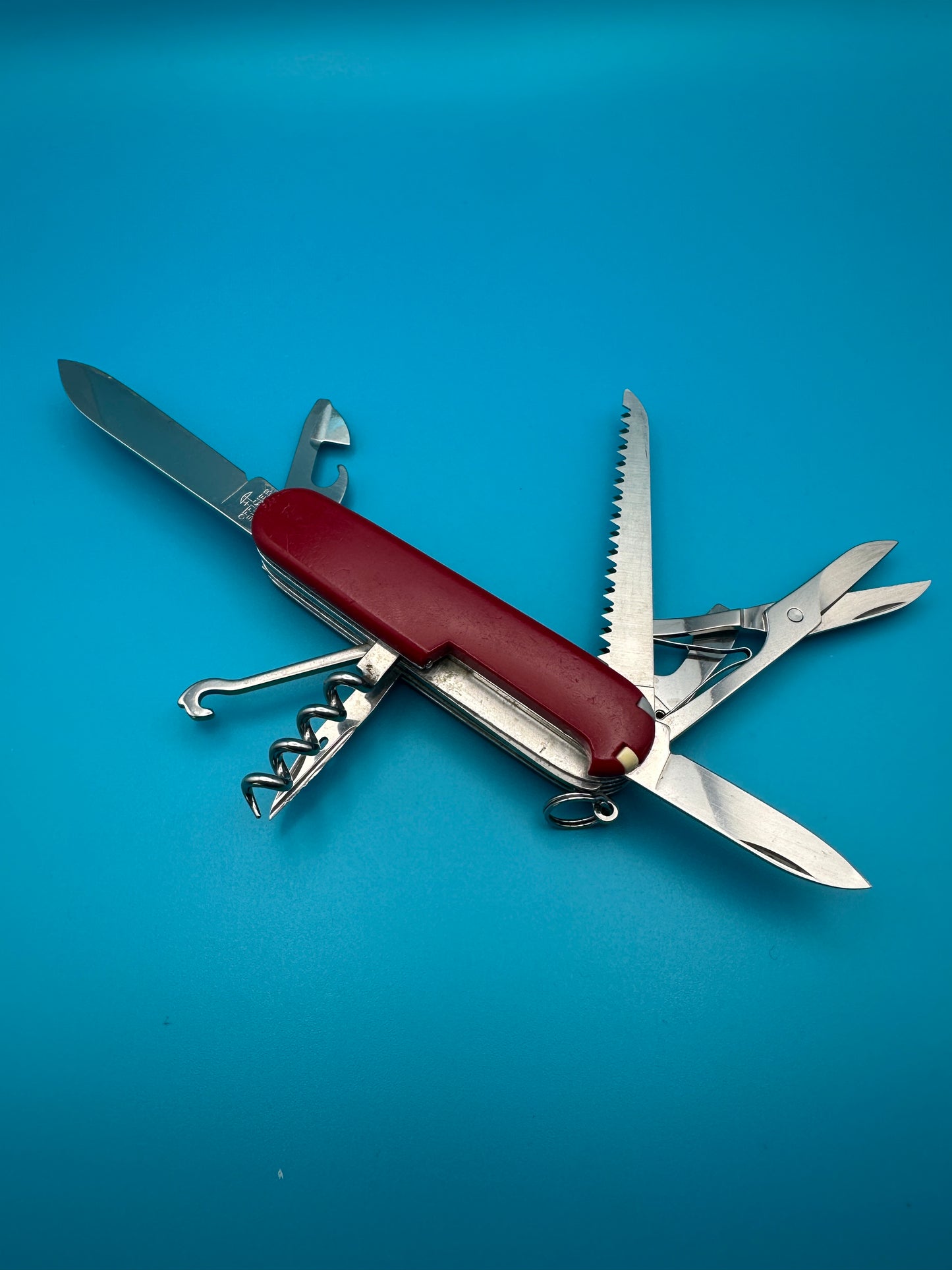 Swiss Army knife Victorinox Huntsman with scissors, can opener, and tools extended