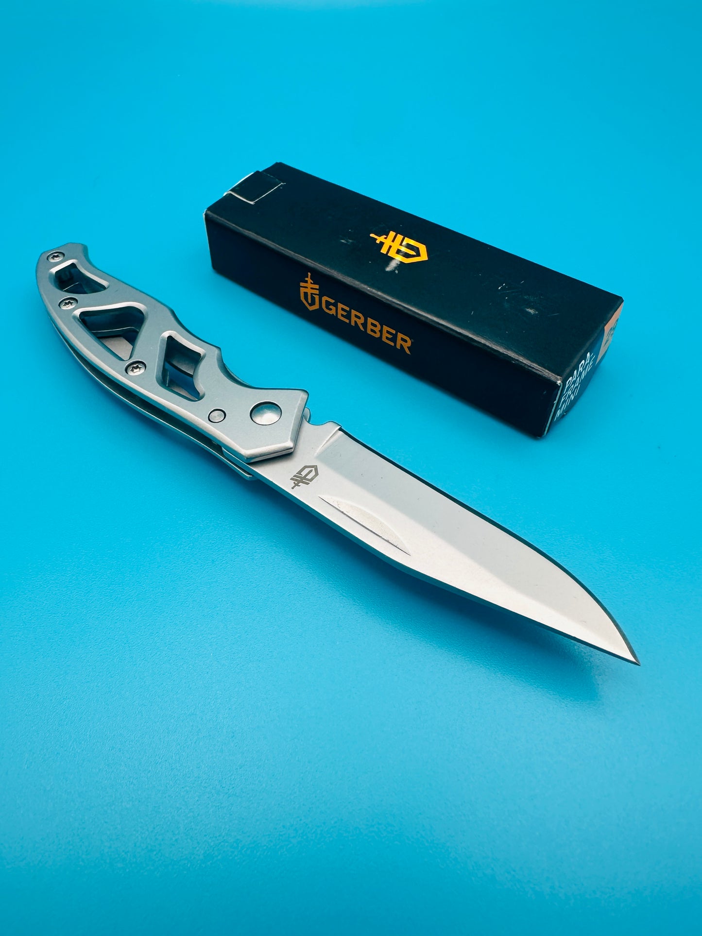 Gerber Mini Paraframe folding knife with satin blade and box, top view